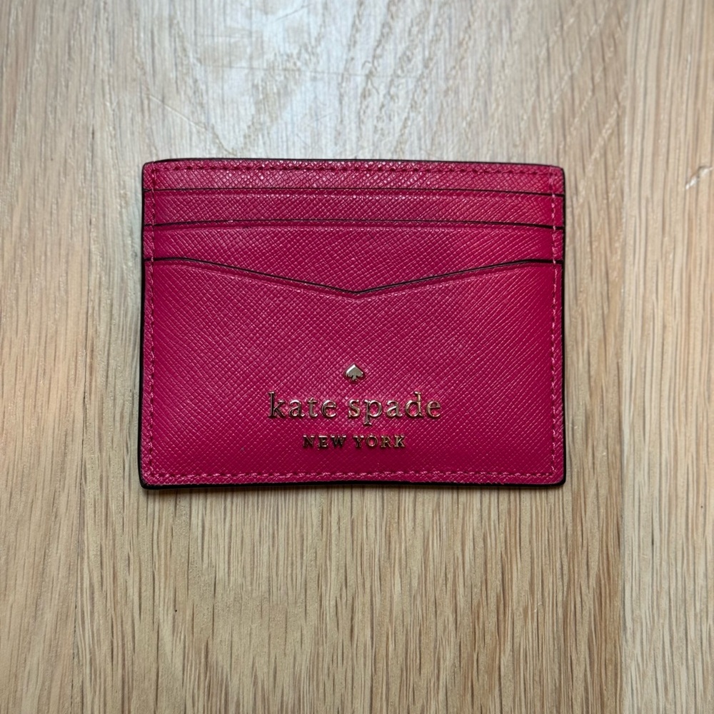 Brand new pink Kate Spade card holder (six external slots and one internal)